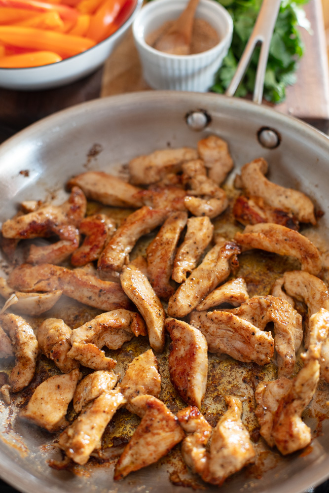 chicken slices cooked in skillet 