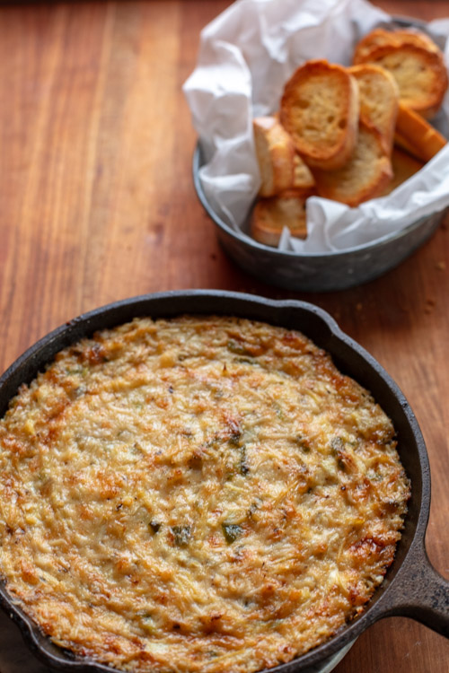 jalapeno artichoke dip in cast iron skillet