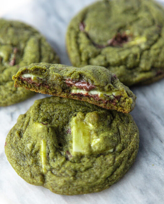 half a matcha cookie stacked to show gooey middle
