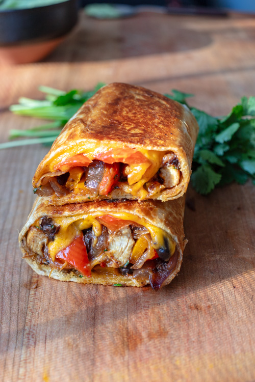 toasted chicken fajita wraps cut in half and stacked 