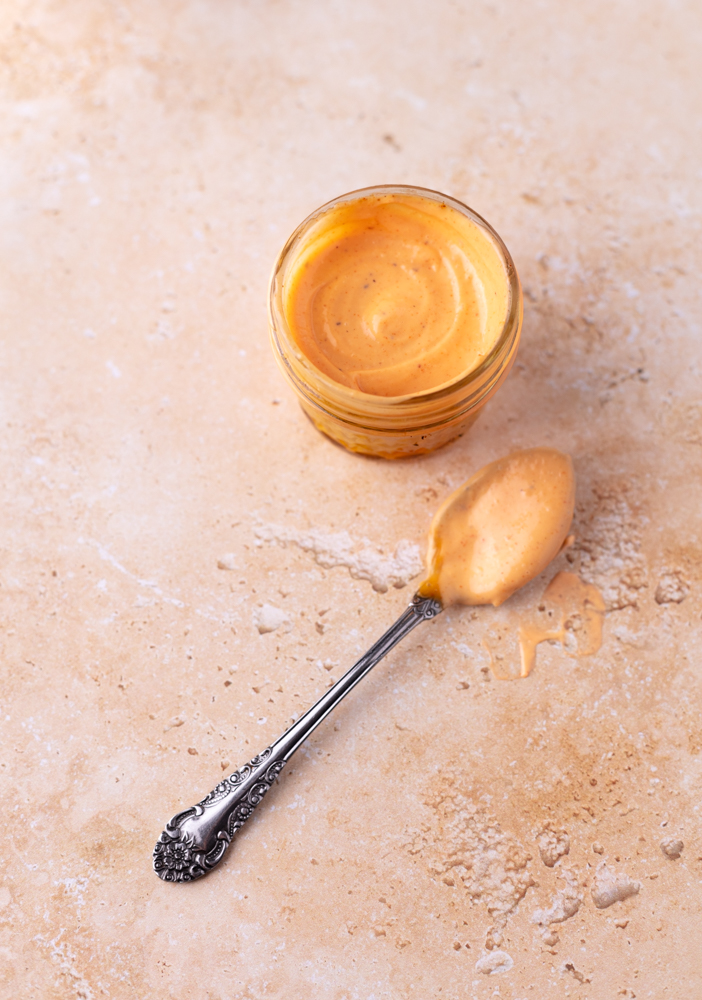 gochujang mayo in a small jar with a spoon
