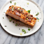 miso butter salmon filet on a plate