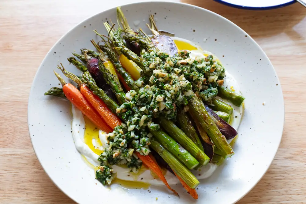 Chunky walnut pesto on top of roasted veggies and yogurt.