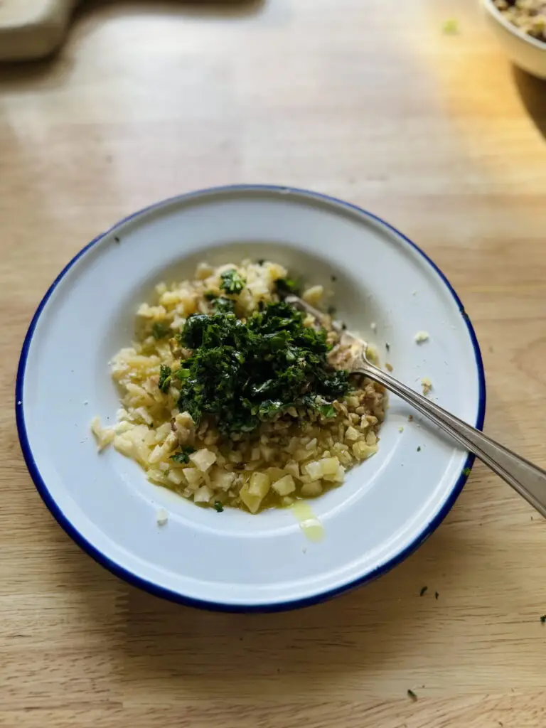 Pesto ingredients in a bowl before being mixed.