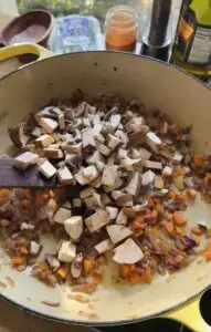 diced mushrooms over sauteed carrots and onions