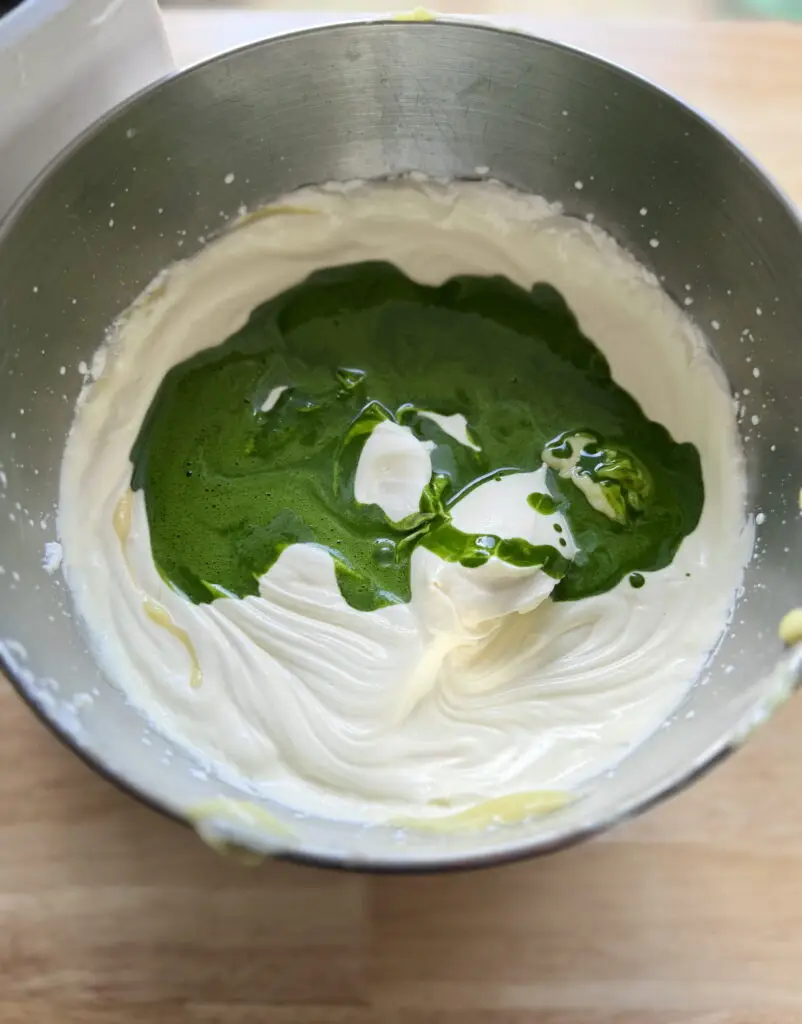 Whipped creamed with matcha liquid on top before mixing.