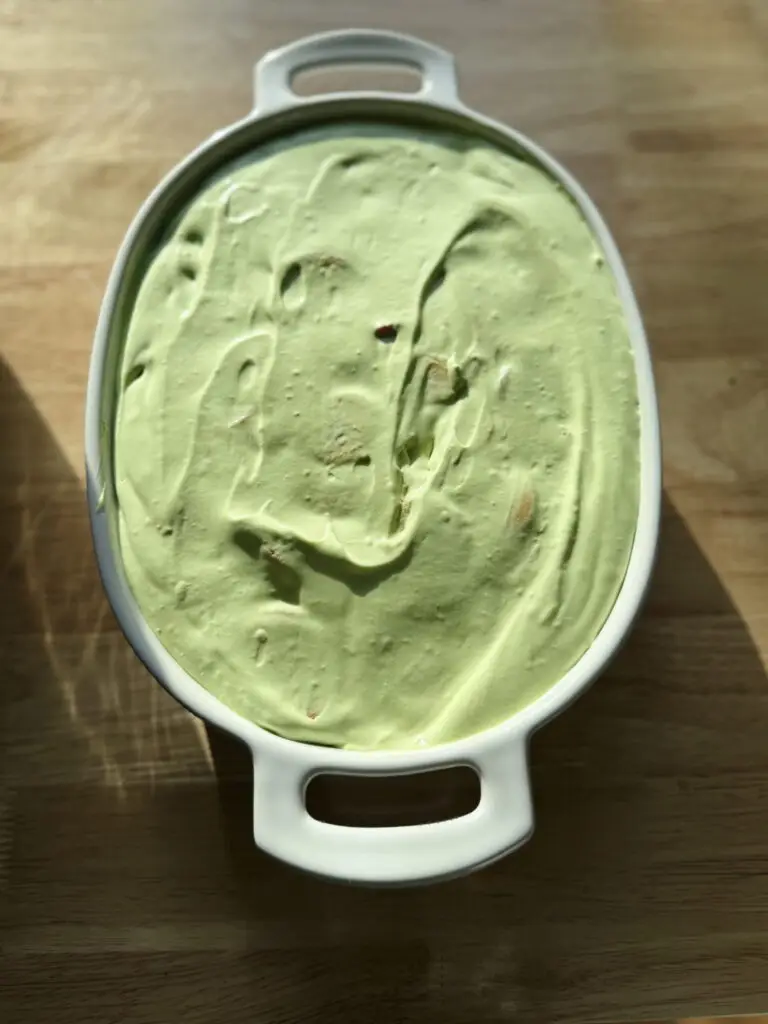 Strawberry banana pudding with matcha placed in a large serving dish.