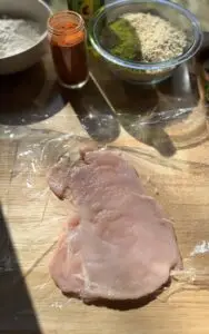 Chicken breast pounded out into a thin piece.