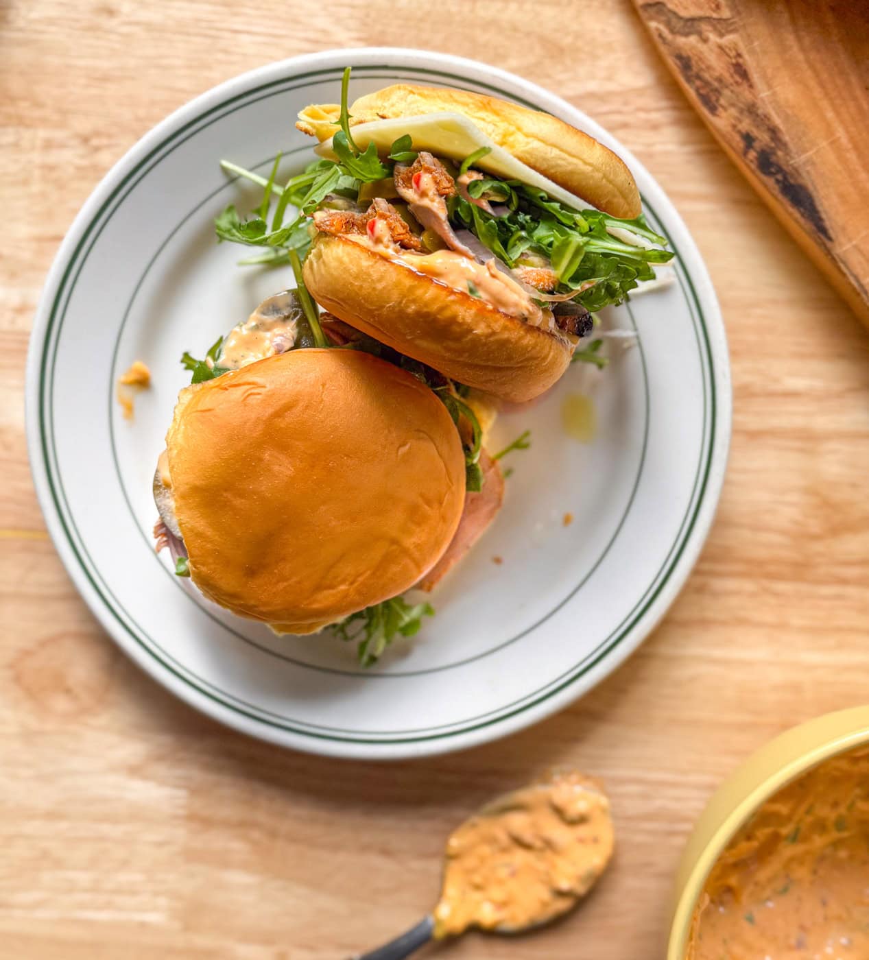 pork tenderloin sliders with Calabrian chili mayo, arugula, and Havarti on toasted buns
