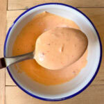 bang bang sauce in a bowl creamy sweet and spicy sauce