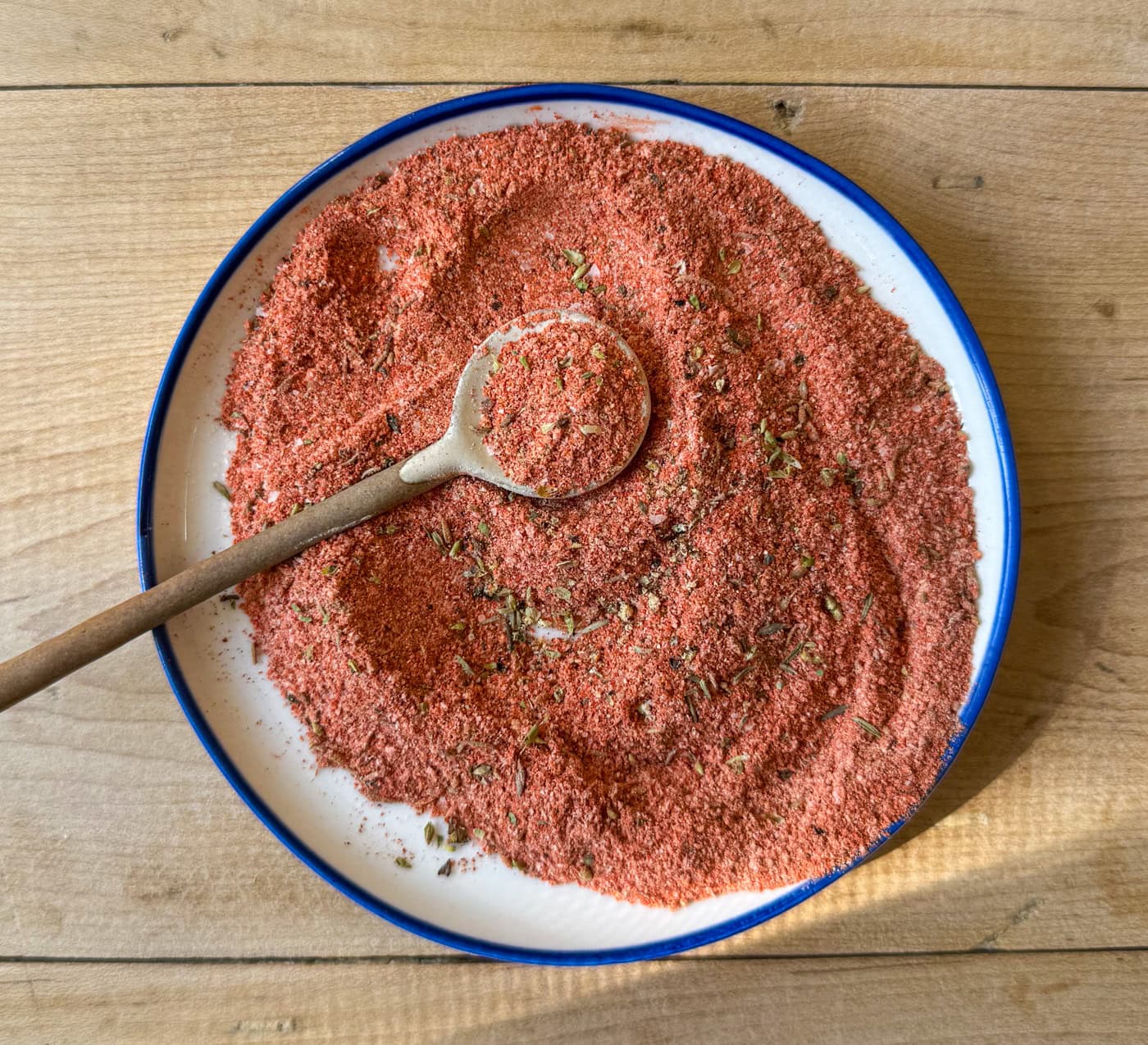 homemade blackened seasoning spice blend mixed in bowl with spoon