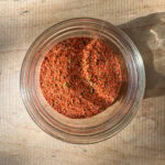 homemade blackened seasoning stored in a glass jar