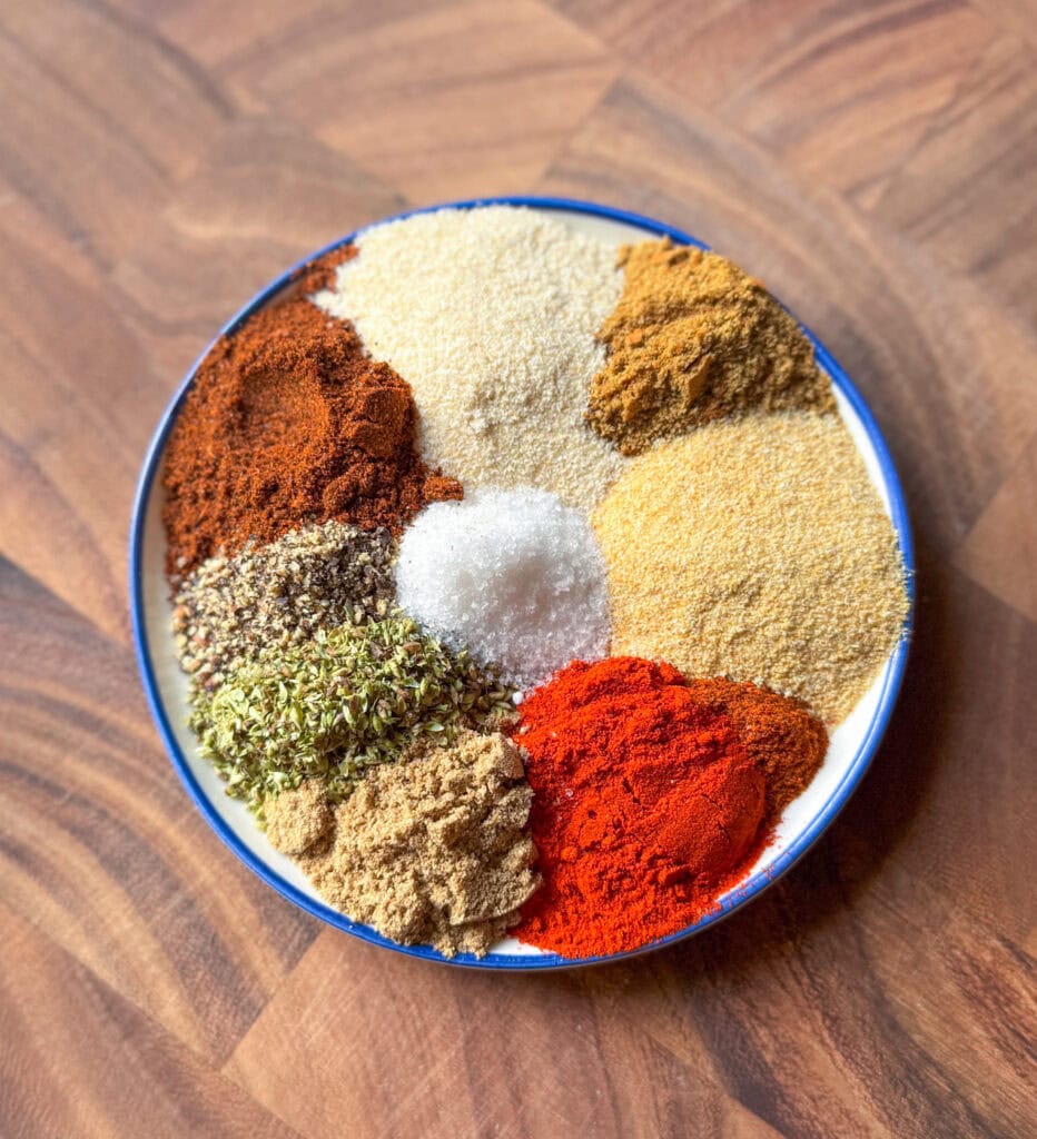 homemade chicken taco seasoning spices arranged on a plate with paprika cumin garlic powder and chili powder