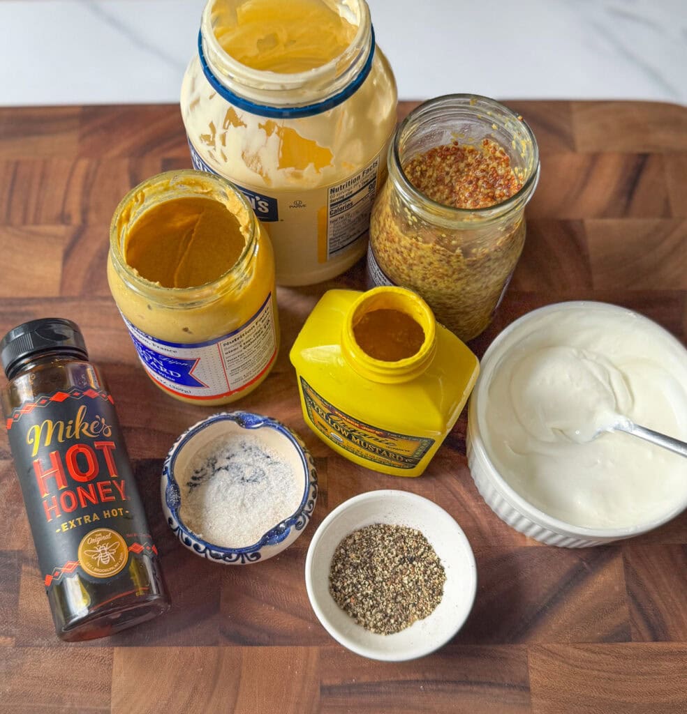 ingredients for hot honey mustard sauce including mayo mustard hot honey sour cream and spices