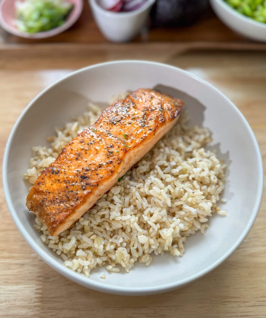 salmon rice bowl with seared salmon over rice