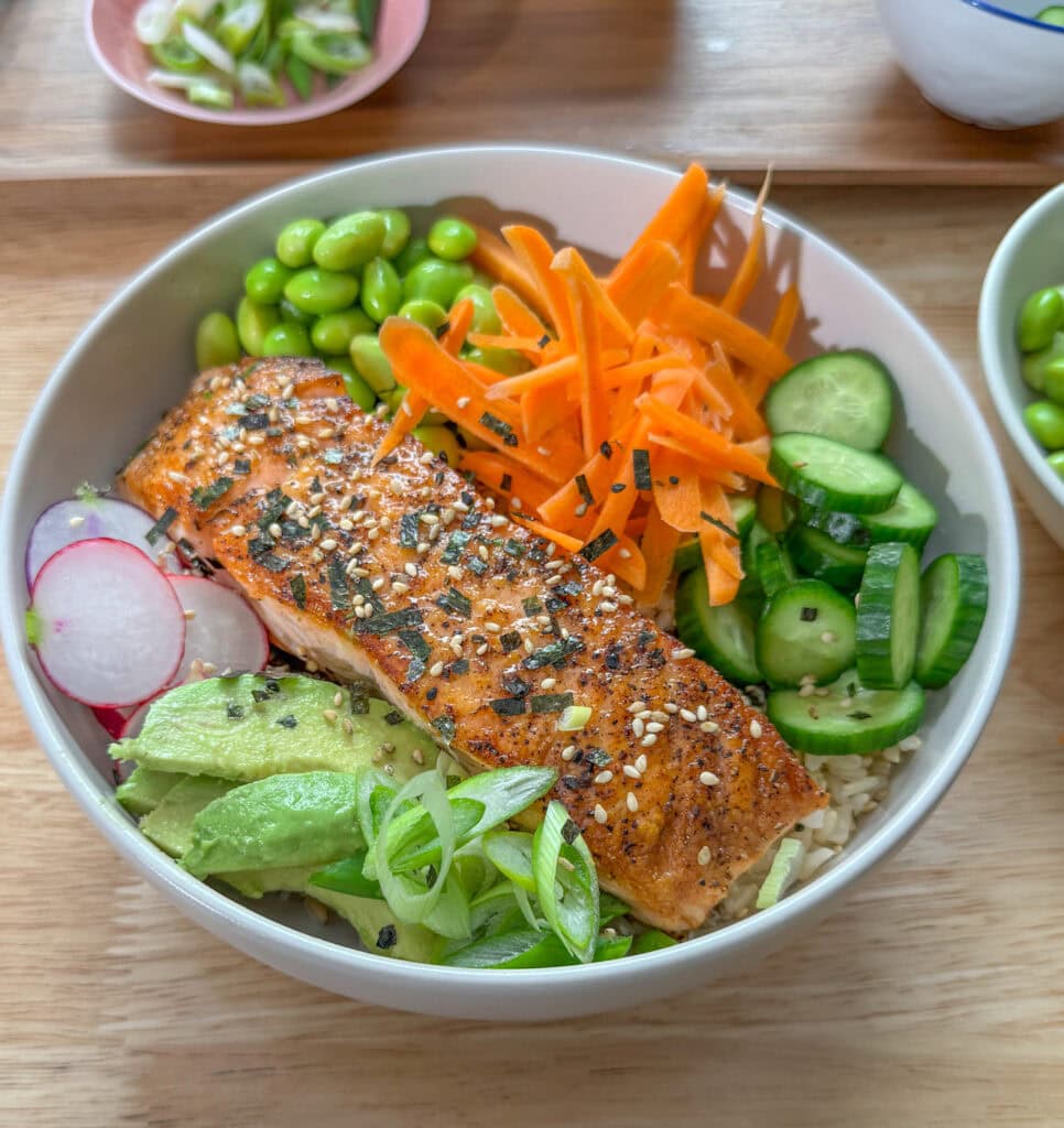 Salmon rice bowls with loads of toppings, before adding spicy mayo.