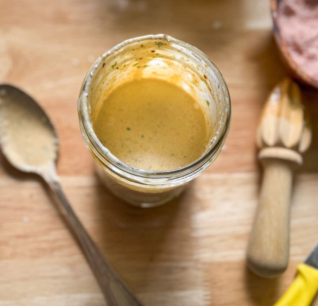 homemade creamy taco salad dressing in a glass jar
