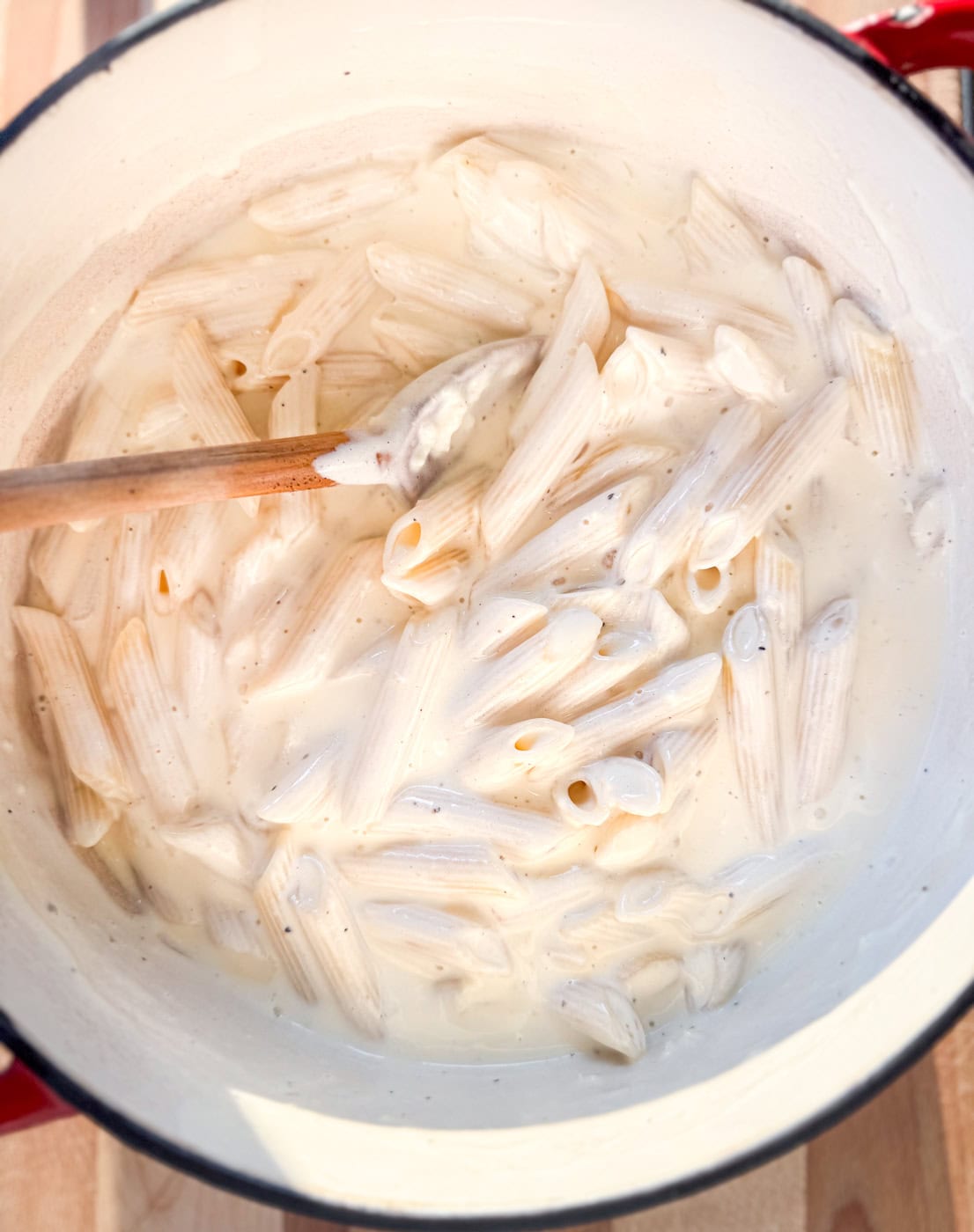 creamy penne alfredo pasta tossed in garlic parmesan sauce