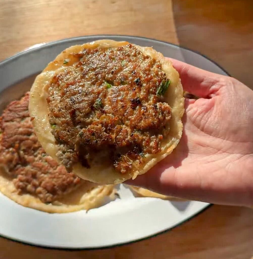 Crispy ground turkey smashed onto a small tortilla for Asian smash tacos.